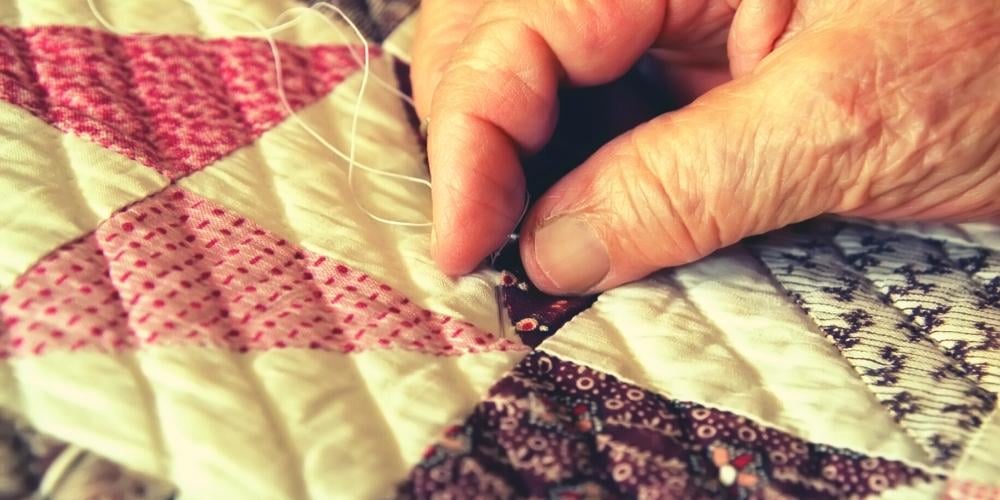 Elderly-person-with-limited-mobility-sewing
