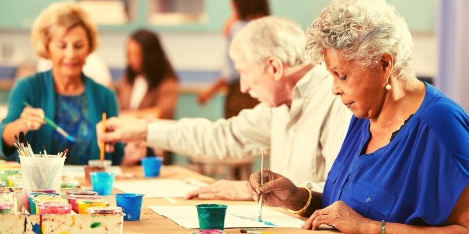 Seniors at a community painting group.