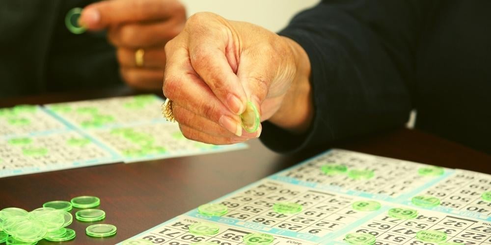 Seniors enjoying bingo together as a community activity.