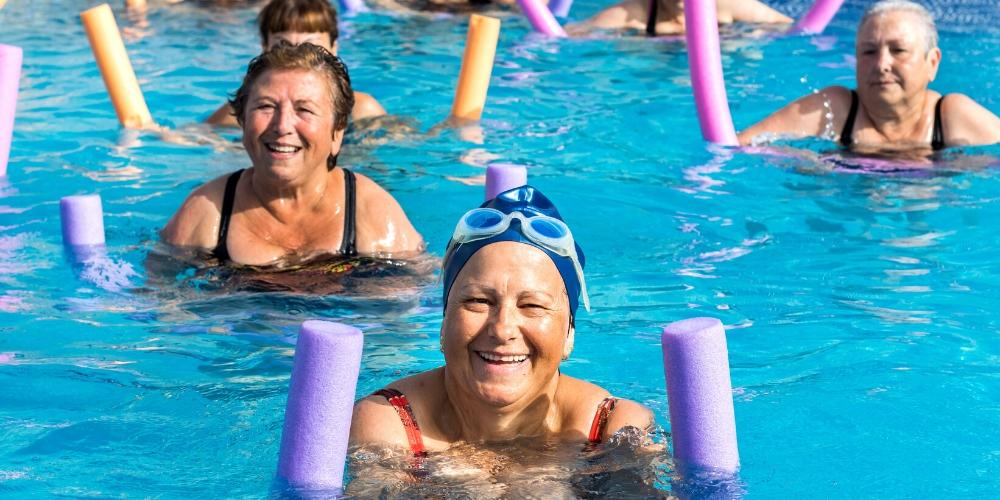 Seniors enjoying swimming and aqua aerobics